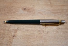 A Parker 45 ballpoint pen dark green with flighter cap having gold trim caps