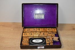 An early 20th-century Percy Leslie of Liverpool rubber stamp & ink set, to feature number and