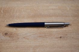 A Parker Jotter ballpoint pen in dark blue with metric converter
