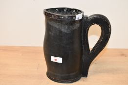 An unusual early 20th-century Ross of Winchester Silver and leather 'Bombard' jug, featuring a