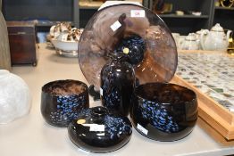 A selection of 20th-century Guernsey Island Studio glass, to feature deep purple hues with a light