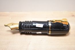 A large late 20th-century Silver Crane Company novelty ceramic Parker Fountain pen-shaped desk tidy,