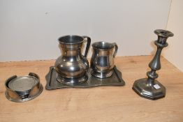 Thought to be 18th-century pewter candlestick, featuring a shapely baluster turned column upon an