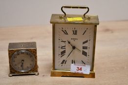 Two 20th-century Swedish brass clocks, to feature a brass Swiza 8 mantel clock and a small Zenith