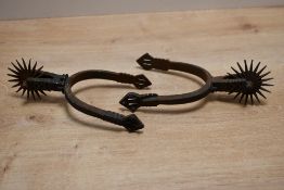 A pair of small late 19th-century South American, Chilean iron 'huasos' spurs, featuring hand etched