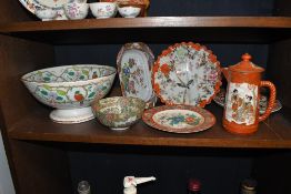 A group of 20th century Oriental porcelain to include bowls, plates and a coffee pot all featuring