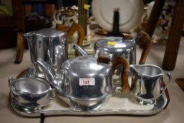A mid 20th-century Picquot ware magnalium tea and coffee service, featuring moulded sycamore wood