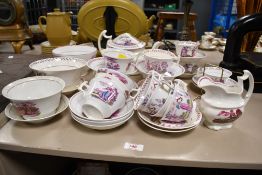 Thought to be a 19th-century Staffordshire-style pink lustreware “Charity” part tea set, to