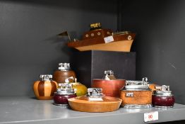 A quantity of 20th-century wooden table lighters, to include both Rolstar and Ronson examples,