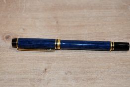 A Waterman Le Mans 200 converter fill Rhapsody in Caviar Blue having Waterman Ideal Paris 18k 750