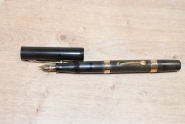 A Waterman 52 lever fill fountain pen in Black with two hallmarked gold bands to the barrel having