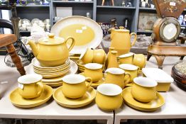 A 20th-century Denby Pottery 'Ode' tableware, featuring a mustard yellow and white Greek Key-style