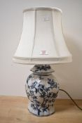 A vintage Rochamp Limited blue and white Oriental-style ceramic lamp base, of flattened ginger-jar