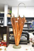 A mid 20th-century French-style copper and brass umbrella stand, designed to resemble an upside-down