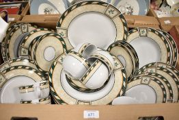 A Studio Concept part dinner service having a cream leaf patterned band edged by a green and cream