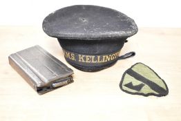 Royal Navy WW2-period black cap with H.M.S. KELLINGTON gold lettering on black silk tally, the cap