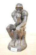 A 20th century resin reproduction of Auguste Rodin's 'The Thinker', no signatures or markings,