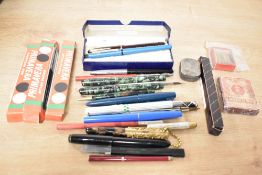A selection of vintage writing equipment. Includin Wyvern lever fill fountain pen and roller ball