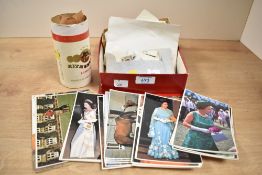 A small selection of assorted loose stamps and royal memorabilia postcards.