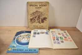 Three partially filled stamp albums including a Stanley Gibbon Super-Jet stamp album and two