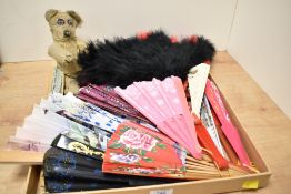 A large collection of assorted vintage fans sold along with a small very loved teddy bear.