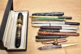 A collection of various fountain pens and pencils including a Parker 35 with lustraloy cap