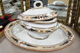 A large vintage meat plate and matching tureen which has been in receipt of historical repair with