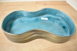 A Beswick Pottery dish, formed as a pond, model number 1989, measures 31cm approximately.