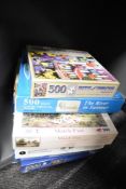 A collection of eight jigsaw puzzles three still in original cellophane wrapper two being King