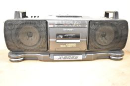 A Sharp Stereo Radio Cassette Recorder.