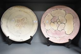 Two decorative 20th-century Kenyan carved soapstone chargers, featuring incised swimming fish