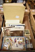 A collection of vintage postcards loose and in an album sold along with a small quantity of