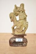 A 20th-century Chinese hardstone carved decorative figure of an immortal, presumed to feature