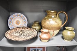 A quantity of 20th-century studio pottery; to include a large decorative charger with floral and
