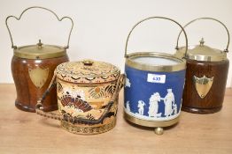A collection of four vintage biscuit barrels including a hand painted Japenese Satsuma barrel, a