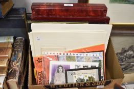 A collection of stamps contained within five stamp albums along with loose leafs, and a folder