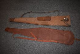 Two Gun Slips one made by Brady all canvas with leather trim and straps and the other unbranded