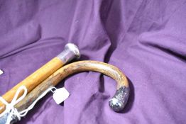 Two silver topped canes measuring approximately 90cm long