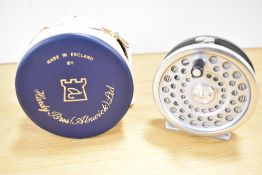 A Hardy marquis #6 3, 1/4 inch trout fly reel in its original blue zippered case very little signs