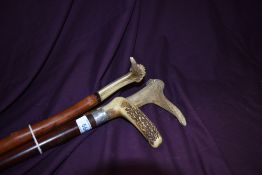 Three antler handled walking sticks all approximately 90cm long