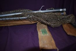 Five vintage fishing rods and a large folding landing net
