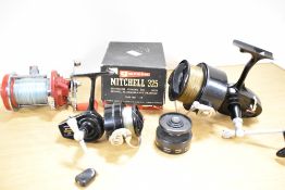 Three vintage fishing reels a Garcia Mitchell 325 in original box with instructions a Garcia