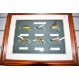 A display of six mounted flies titled 'English Salmon Bait circa 1900 ' framed measuring 36cm x