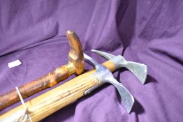 Two small headed ice axes and a hazel walking stick measuring 95 89 and 84 cm respectively