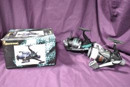 Two spinning reels by Browning an MX150 and a boxed Camcad 3600 reel with spare spool