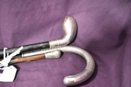 Three walking canes the bulbous headed cane thought to be silver and the other two thought to be
