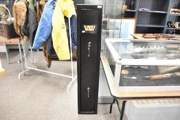 A 3 gun shotgun cabinet measuring 20cm x 24cm x 130cm. Made by westwood it has 2 locks and 2 keys