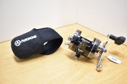 An AKIOS 651 SCM Shuttle multiplier reel in its original soft case