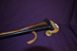 Three short walking sticks 71-89 cm. One is ebonised and one crooked stick with a carved shepherds