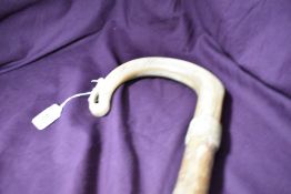 A carved horn shepherds crook walking stick measuring 137cm long